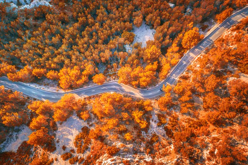 aerial-view-of-mountain-curve-road-with-cars-pixalink-about-us